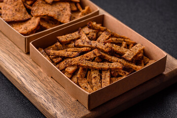 Crispy homemade brown bread crackers or croutons with seeds and grains