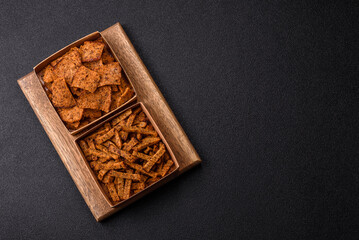 Crispy homemade brown bread crackers or croutons with seeds and grains
