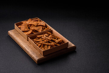 Crispy homemade brown bread crackers or croutons with seeds and grains