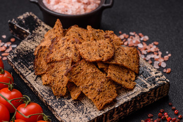 Crispy homemade brown bread chips with seeds and grains