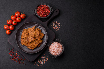 Crispy homemade brown bread chips with seeds and grains