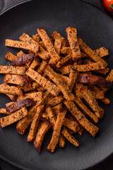 Crispy homemade brown bread crackers or croutons with seeds and grains