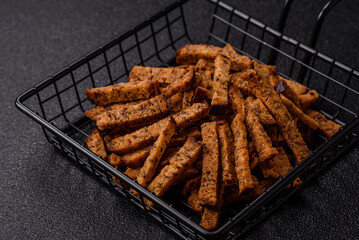 Crispy homemade brown bread crackers or croutons with seeds and grains
