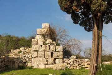 Stone ruins of ancient fortifications on Mount Tabor. Bridge over the moat.