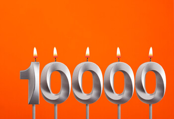 Candle number 10000 - Number of followers or likes.