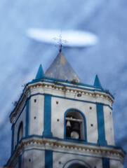 Defocused and blurred shot of the Church of Villavieja through a net, Huila, Colombia. Creative and artistic photography.