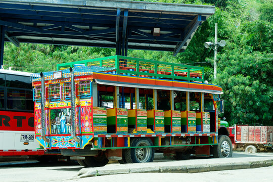 Andes, Antioquia, Colombia, 08 05 2024 : Picture of a chiva in the bus station of Andes. Colorful traditional rural bus in Colombia.
