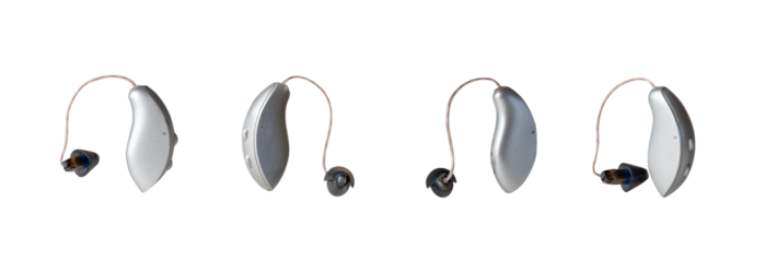 Four modern hearing aid devices displayed on a white background, showcasing various angles and placements