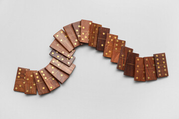 Wooden dominos blocks on grey background