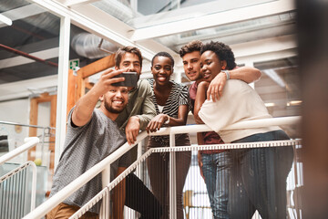 Group, people and selfie at startup, smile and hug in office with diversity, solidarity and post on...