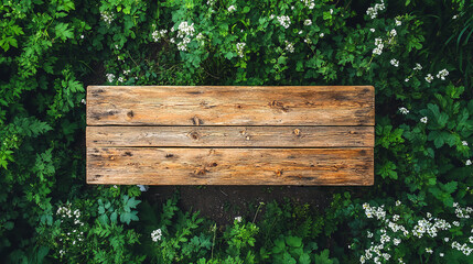 Fototapeta premium Top view of empty plank wood table on greenery background in garden