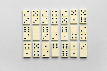 Texture of white dominos blocks on grey background