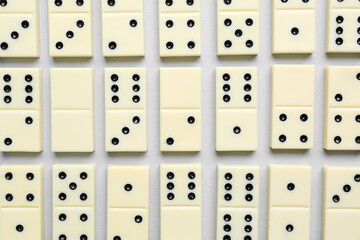 Texture of white dominos blocks on grey background