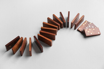 Many wooden dominos blocks on grey background