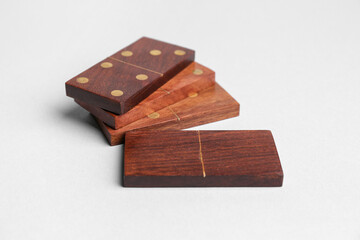 Wooden dominos blocks on grey background
