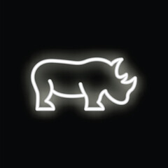 White neon sign shaped like a rhino is shining on a black background
