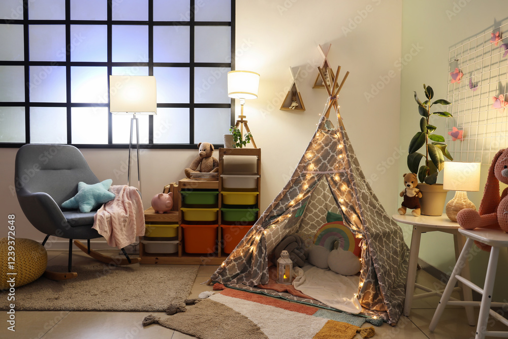 Canvas Prints Interior of stylish children's bedroom with play tent, glowing lights and toys at night