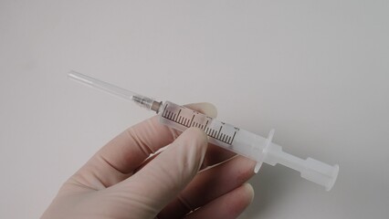 A CloseUp View of a Syringe That is Fully Prepared and Ready for the Injection Procedure