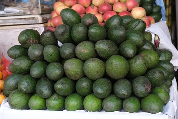 Stack of green avocado on stall in Kathmandu, Nepal