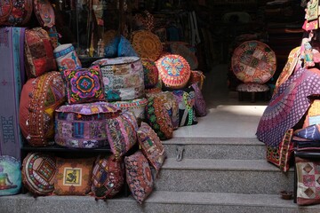 Shop with colorful pillows with ethnic patterns in a bazaar in Kathamndu, Nepal
