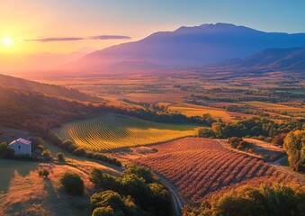 Stunning drone photography captures the vibrant hues of autumn fields in the French Alps during the harvest season