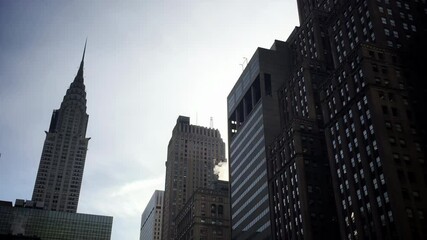 Chrysler Building, an Art Deco Skyscraper, Against Sunset Sky in Midtown Manhattan - 4K