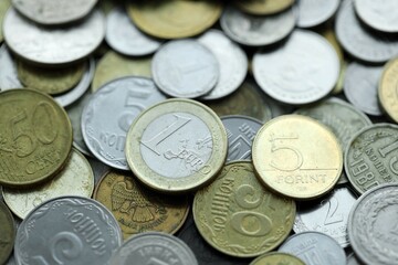 Big pile of different coins from various currencies and different countries around the world. Currency exchange