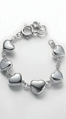 A single silver bracelet with heart-shaped charms against pure white background