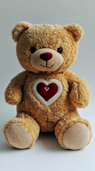 Obraz premium A single teddy bear with a love heart sewn onto its chest against pure white background