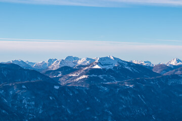 Snow-capped peaks of majestic Carnic Alps seen from mountain peak Tscheckelnock, Carinthia, Austria. Dramatic mountainous range. Winter wonderland landscape. Wilderness, Austrian Alps. Clear blue sky