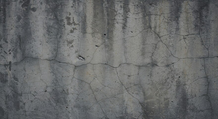 Obraz premium Rough concrete wall with subtle cracks and a mix of light and dark gray tones