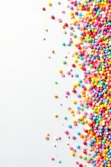 Fototapeta premium Rainbow sprinkles scattered on white background, pastel, assorted sprinkles