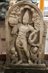 Ancient stone statue at Gangaramaya Temple