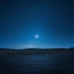 A serene night sky filled with stars over rolling desert hills. Perfect for themes of tranquility, stargazing, and natural wonders.