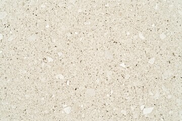 Light beige brown particleboard background with a grainy texture