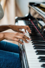 Obraz premium Close-up of woman playing piano