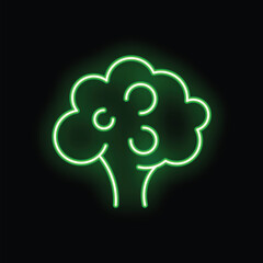 Green neon sign illuminating a broccoli vegetable on a black background