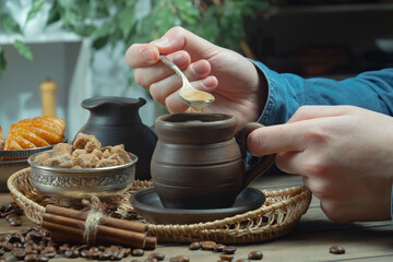 Coffee beans in the hands of an elderly man. Close-up.
