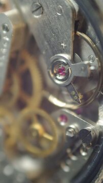Cogwheels inside clockwork. Close-up. Concept Eternity, Teamwork , Idea Technology. Tick-Tick Sound