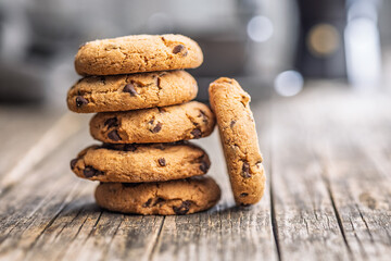 Chocolate chip cookies on wooden table.