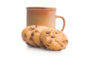 Chocolate chip cookies and mug  isolated on white background.