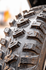 Close-up view of an off-road tire to showcase rugged tread design
