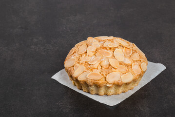 Coffee square cookies with a filling of coffee marmalade in the shape of a cup, heart, coffee pot, beans, words of a coffee and love. On a wooden plate. 