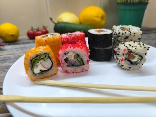 selection of fresh sushi on a white plate.High quality photo