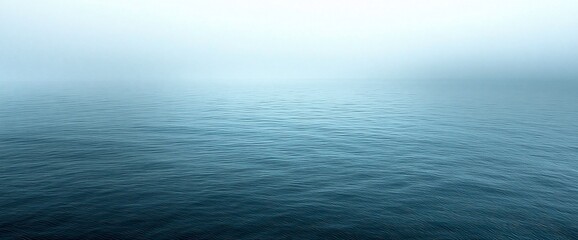 Obraz premium Misty ocean, calm water, foggy sky, sea horizon, nature backdrop