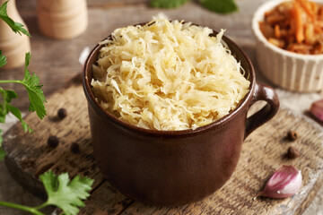 Fermented cabbage or sauerkraut in a clay pot