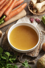 Chicken bone broth in a white soup bowl
