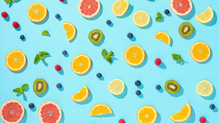 Vibrant Citrus Slices on Turquoise Background
