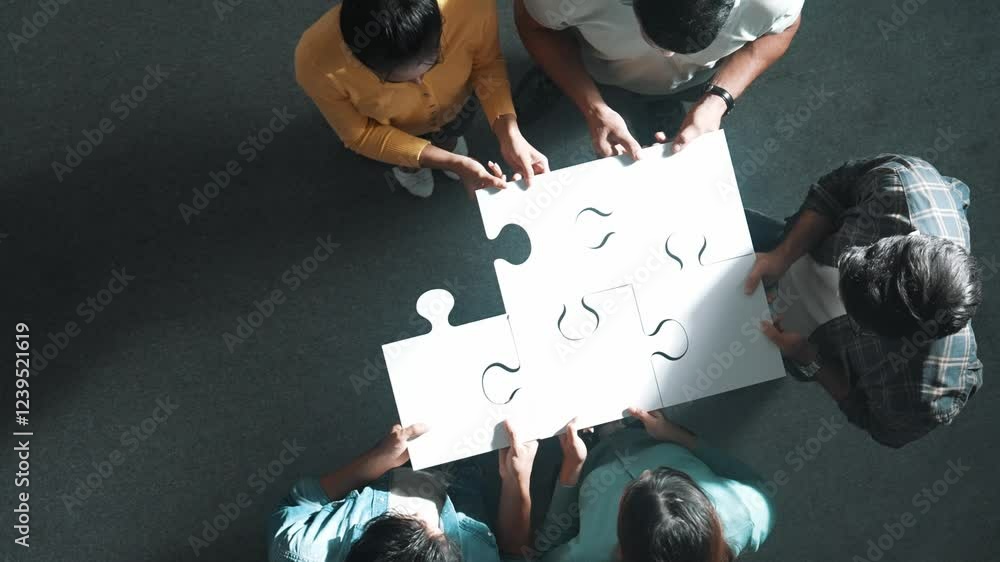 Aufkleber top down view of business people put last piece of jigsaw puzzle together to complete puzzle and sta
