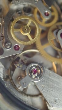 Cogwheels inside clockwork. Close-up. Concept Eternity, Teamwork , Idea Technology. Tick-Tick Sound